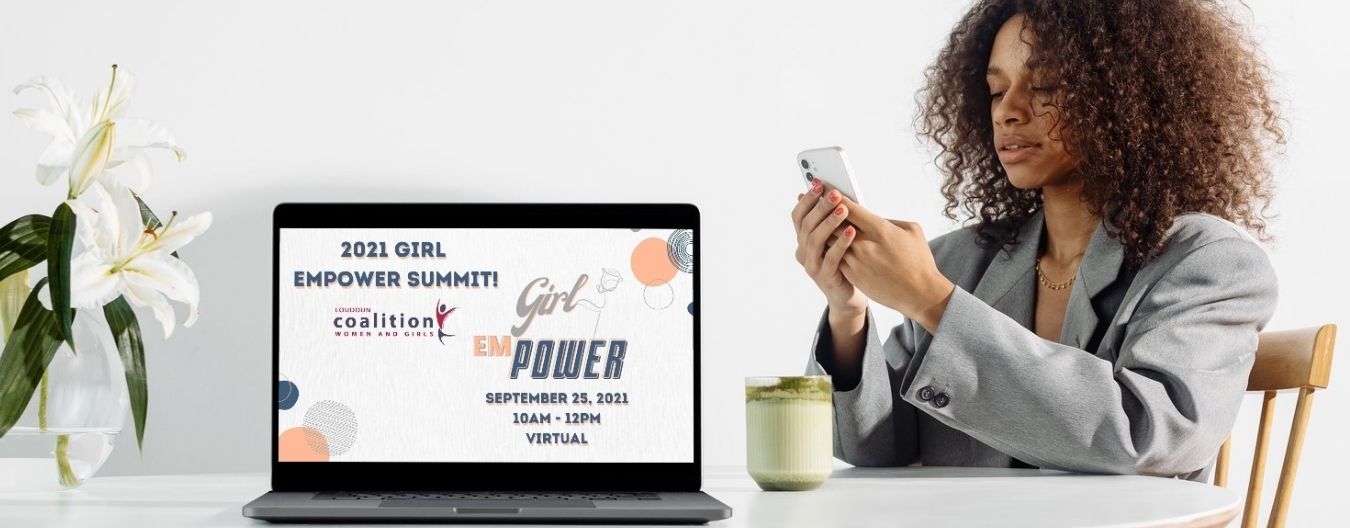A woman with a laptop announcing the Girl emPower event on September 25, 2021