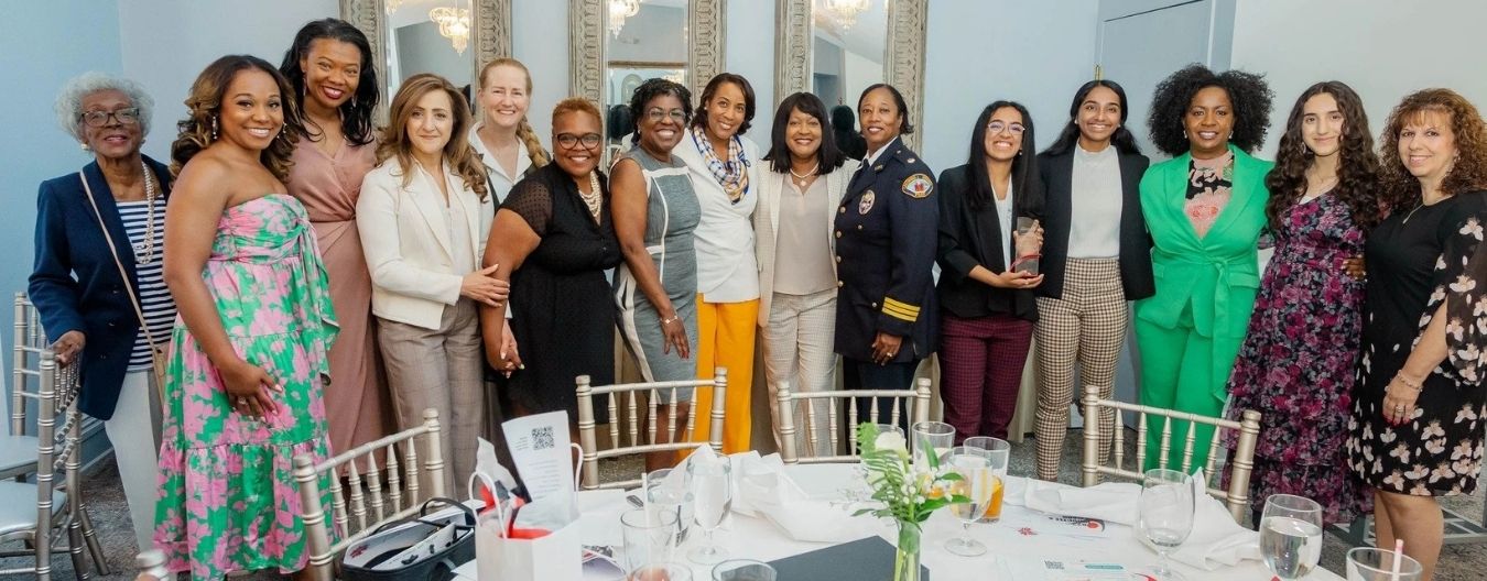 The women of LCWAG lined up smiling at the camera for the Biennial Loudoun Women's Hall of Fame